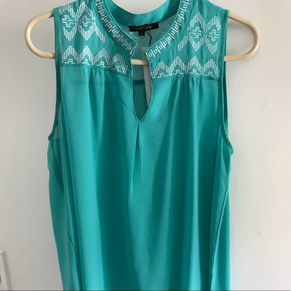 Gorgeous embroidered turquoise shell by Papermoon!